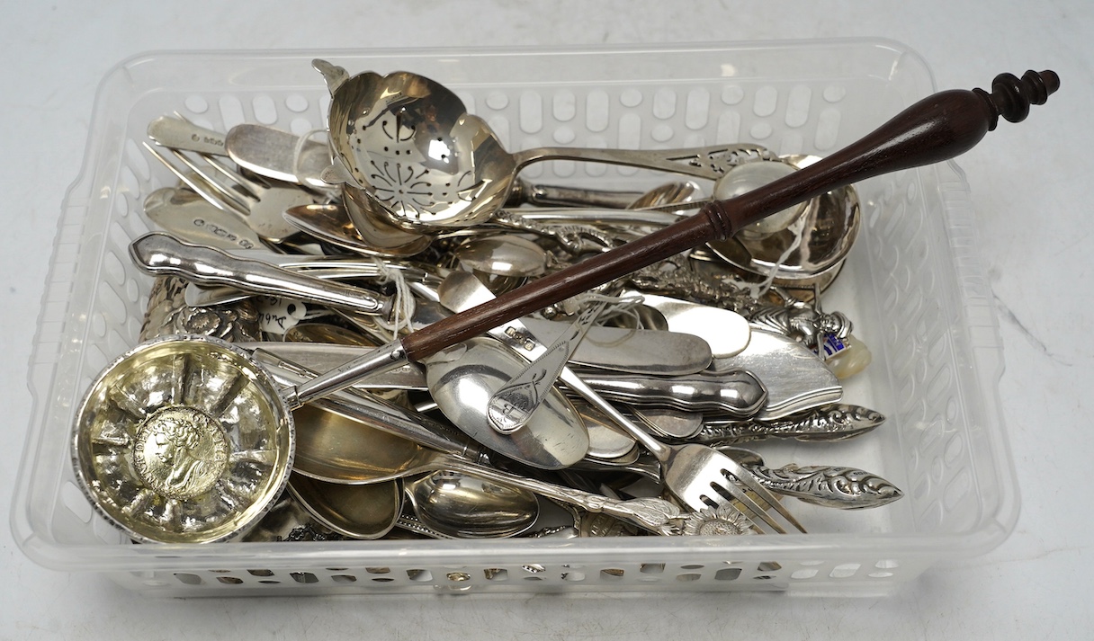 A collection of assorted mainly 19th century and later small silver and white metal items, including flatware, a photograph frame, a Japanese? scent bottle, a tea strainer, a toddy ladle, etc. Condition - poor to fair to